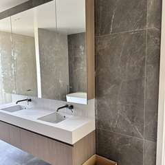 Double vanity, stone-look wall
