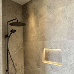 Lit niche, black rain shower