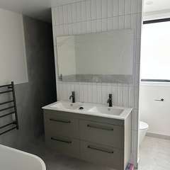Double vanity, white vertical tiles