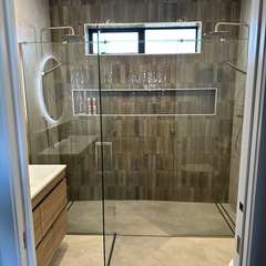 Double shower, olive wall
