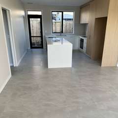 Grey floor, open-plan kitchen