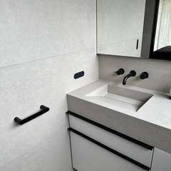 Tiled vanity, black tapware