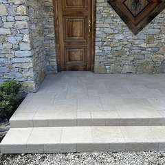 Entry steps by a stone wall